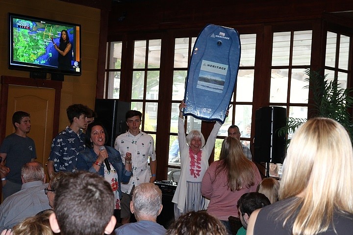 Rose West displays the boogie board she won at the Randles Boys Foundation’s Sunday Fun Day.