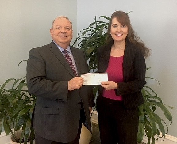 Sturdy Savings Bank Director of Retail Banking David Repici presents a check to Jersey Shore Pops Conductor and Musical Director Linda Gentille in support of the organization’s 2019 Summer Concert Series. (Photo courtesy Suasion)