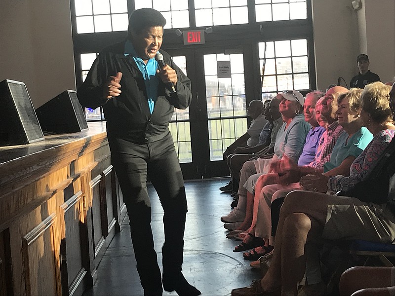 Chubby Checker bounds off stage to get close to his fans.