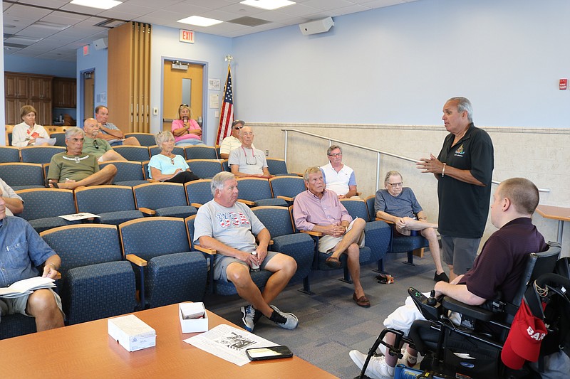 The audience listens to At-Large Councilman Keith Hartzell and Fourth Ward Councilman Bob Barr talk about the issues.