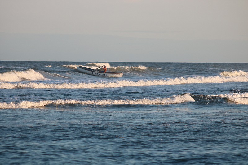 Shannin Theiss of Ocean City rides a wave in at the finish of the singles race.