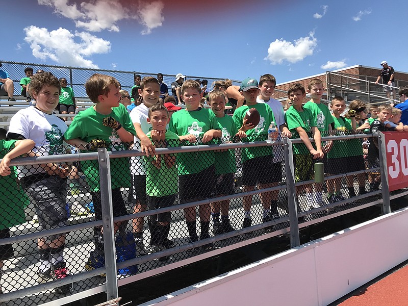 Local kids from the Upper Township Indians take in the action at the Vinny Curry Youth Football Camp at Carey Stadium.