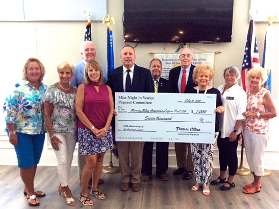 Ocean City’s Night In Venice Pageant Committee presents a $7,000 donation check to American Legion Post 524. NIV Committee members from left, Kathy Lavin, Cathy Finnegan, Sharon Capizzi, Pat Gillian, Susan Cox and Mary Anne Jones. American Legion 100th Anniversary Concert Committee members include (back row) John Van Stone, Mike Hyson, Bob Marzulli and Frank McCall. (Photo courtesy Doug Otto)