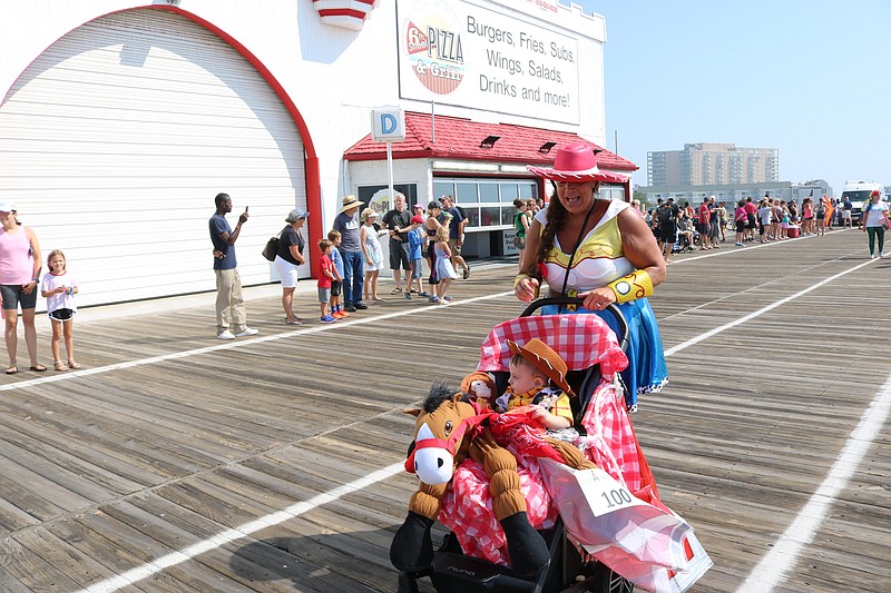 Lynne Desmond, of Ocean City, smiles at her grandson, Cameron Higbee, dressed as "Woody" from "Toy Story" at the 2019 baby parade.