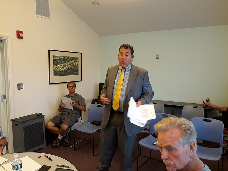 Michael Garcia, a partner with the Ocean City accounting firm of Ford-Scott &amp; Associates LLC, presents the housing authority with a "clean audit."