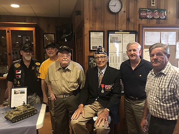 Retired Army Sgt. Joe Caserta (seated) is surrounded by fellow veterans at a ceremony in his honor at VFW Post 6650 in Ocean City. (Photos courtesy Lisa Spengler)