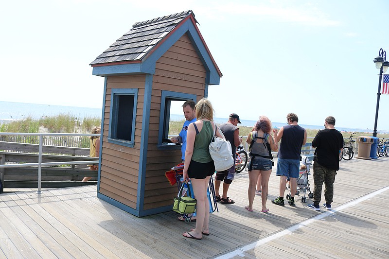 People stand in line over Labor Day weekend to purchase their daily beach tags.