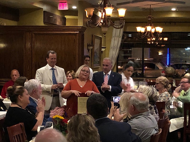 Diane Wieland addresses the crowd at the La Fontana Coast restaurant.