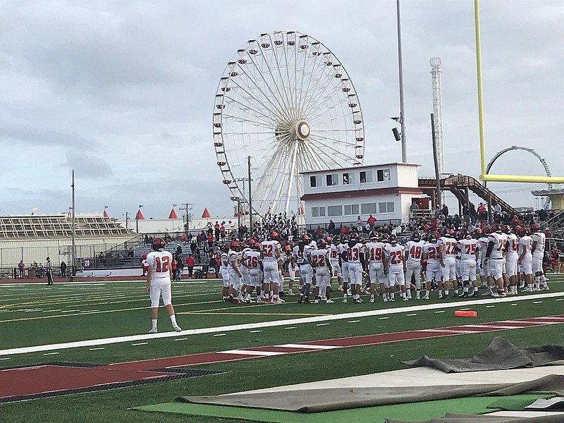 Freshman quarterback Riley Gunnels with teammates before last week’s game at Carey Stadium.