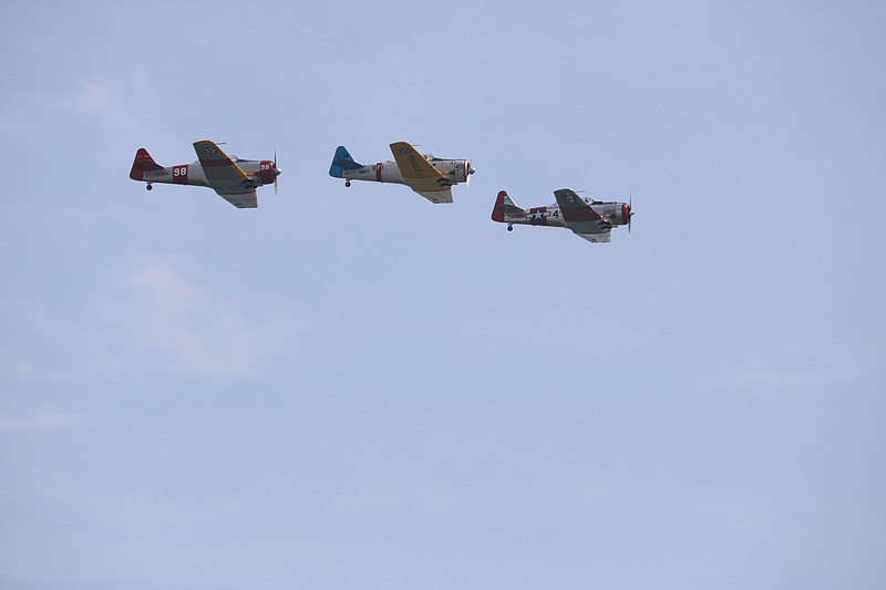 Military planes fly in formation.