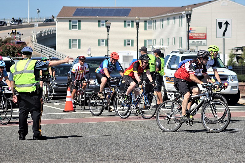 A traffic officer makes sure the cyclists arrive in Ocean City safely.