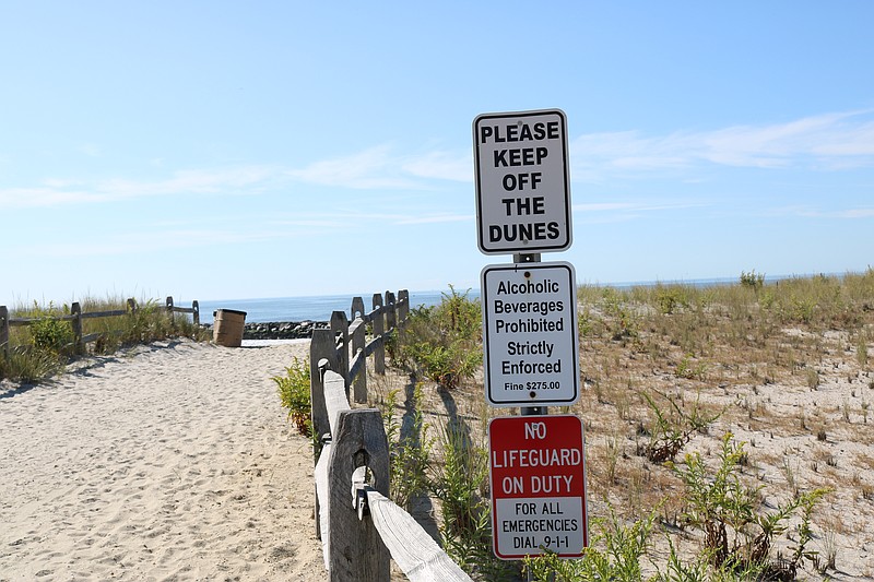 A dune sign is a reminder about the importance of the large structures, designed to take the brunt of a bad storm.