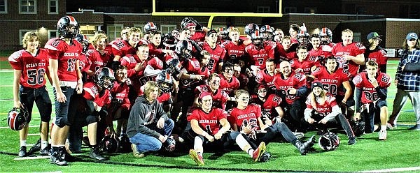 Last year’s team gathers for a group photo after their last home game, a win over Washington Township.