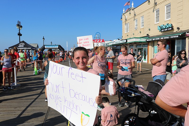 Supporters line the Boardwalk to cheer on their family and friends.