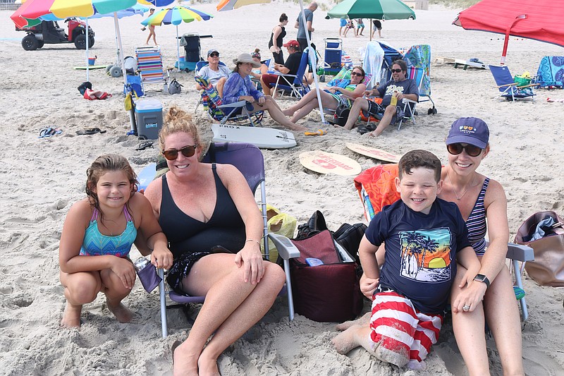 Friends Jennifer Plousis, of Ocean City, and her daughter, Maddie, 9, and Jenifer Bremen, of East Brunswick, with her son, Matthew, 8, enjoy the day on 34th Street beach.