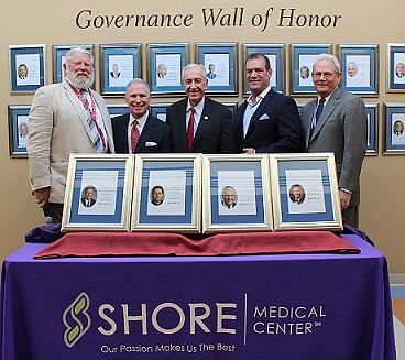 Bill Hughes, center, is honored along with other inductees for the Governance Wall of Honor at Shore Medical Center. (Courtesy of Shore Medical Center).