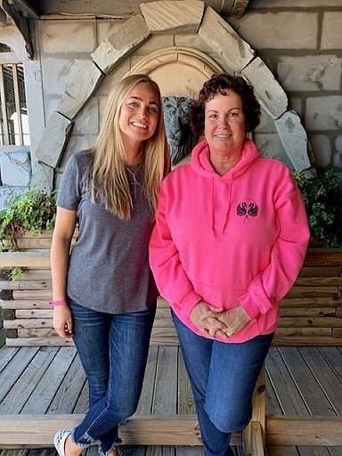 Alisabeth Fleming, left, the organizer of the event, is joined by the owner of Medieval Golf, Diann Walters.