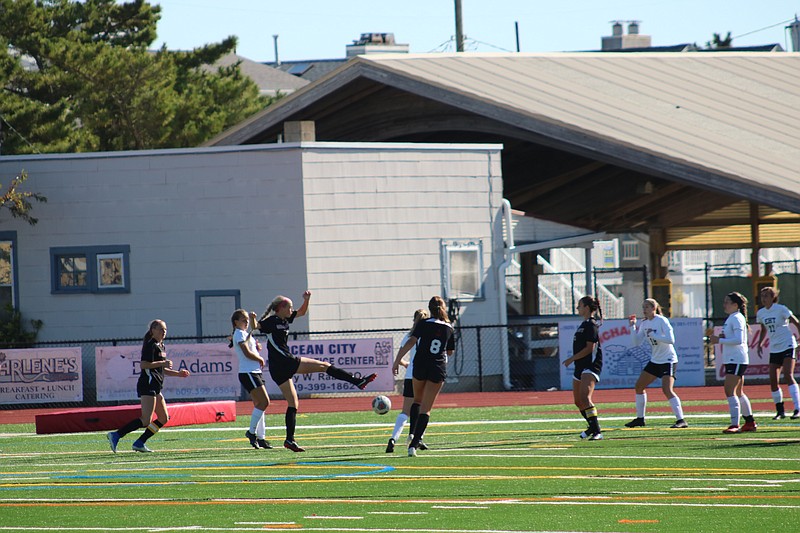 Sophomore Summer Reimet takes a shot on goal.