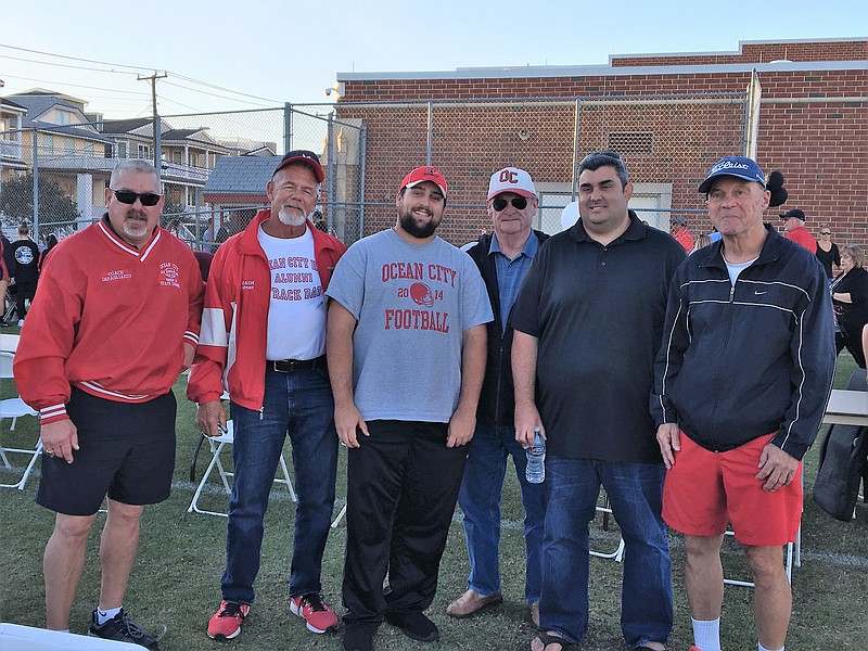 Former coaches and football alumni enjoy a past Red &amp; White Weekend celebration. (Courtesy Marcia Shallcross McCulley)