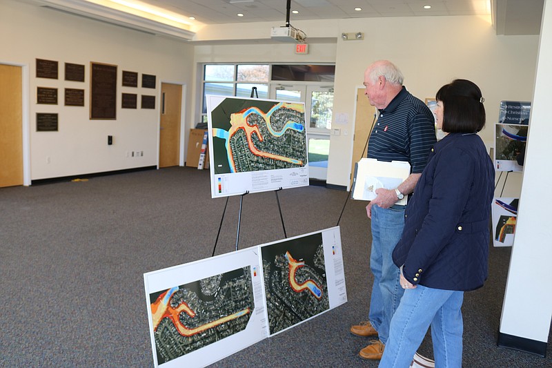 Kathy and Jim Watson, who have an Ocean City vacation duplex on 47th Street, look at some of the renderings for construction projects.