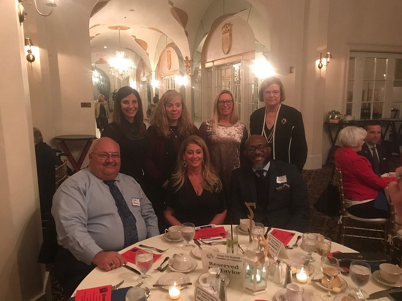 Ocean City Schools Superintendent Dr. Kathleen Taylor, standing, far right, is joined by members of the Board of Education and school administration.