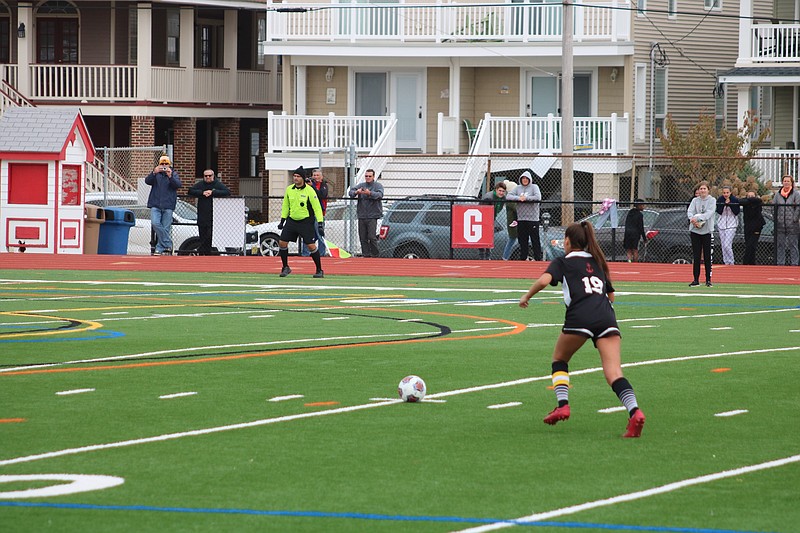 Faith Slimmer, who led Ocean City with three goals, lines up for a penalty kick and score.