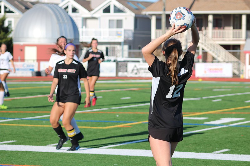 Red Raider Kelsey White (12) surveys the field on a throw-in.