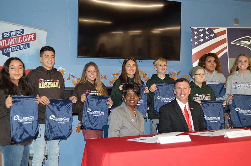 Greater Egg Harbor Regional School District students join Schools Superintendent John Keenan and ACCC President Dr. Barbara Gaba at a signing ceremony to earn ACCC college credits. Ocean City High School students will sign Wednesday. (Photo courtesy of ACCC)