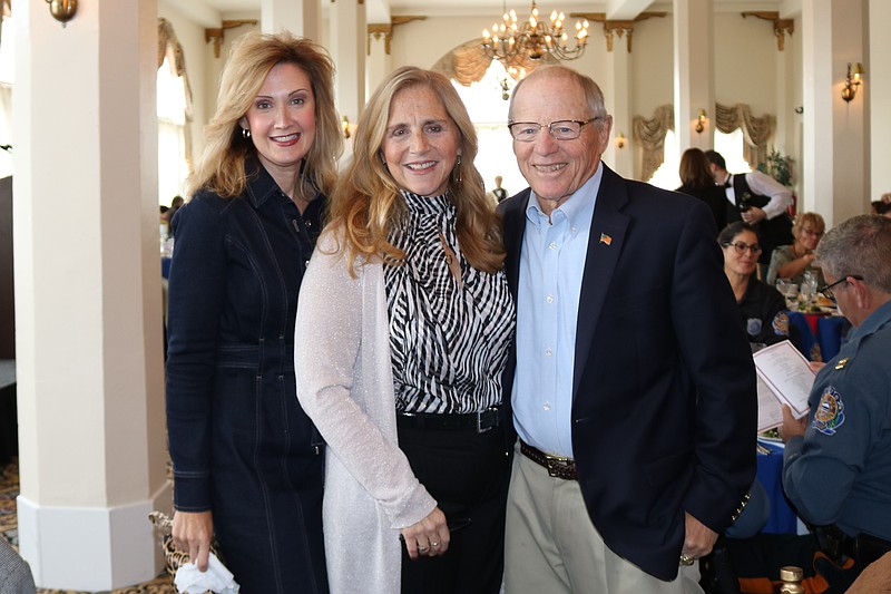 Library Board President Jennifer Shirk, Library Director Karen Mahar and Board of Trustees member Ron Denney share a light moment at the 2019 "Women of Wonder" celebration when Mahar was honored.