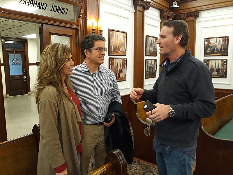 Mayor Jay Gillian speaks to Patty and Stephen Barse after the Council meeting.