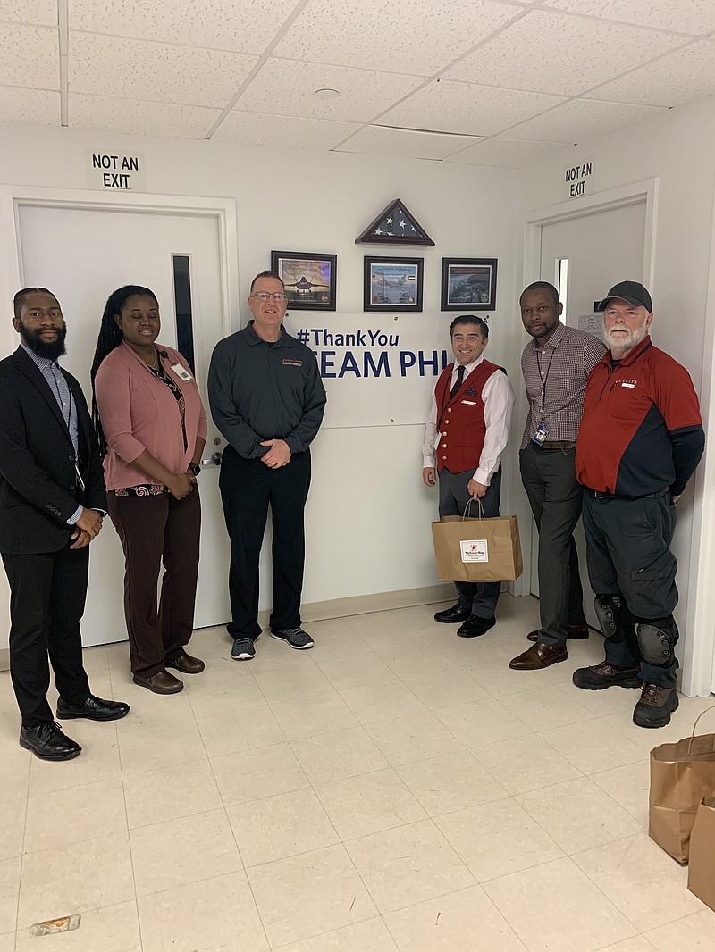 Athletic Director Geoff Haines, third from left, with Delta and other officials. (Photo courtesy Laura Bishop Communication)