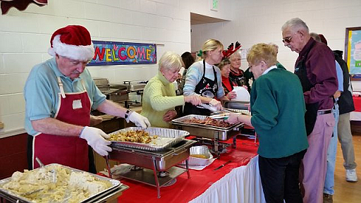 Volunteers serve up Christmas dinners with all the trimmings at the annual event at St. Peter’s United Methodist Church.