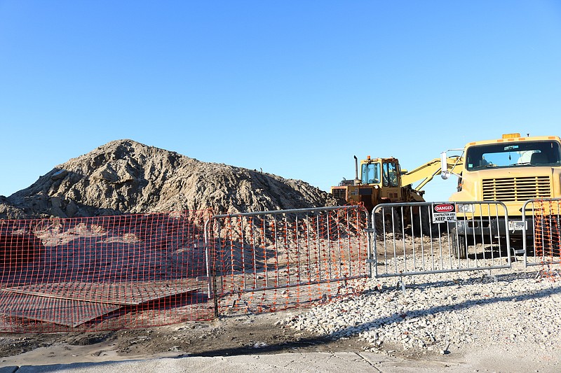 Dredging equipment is in the North Point Lagoon for the project there and at Bayside Center.