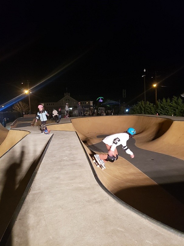 Skaters show off their moves in the park's "bowl."