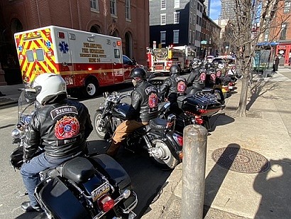 “The Axmen” motorcycle club joined with other groups escorting Greg Browne’s coffin from the church.  