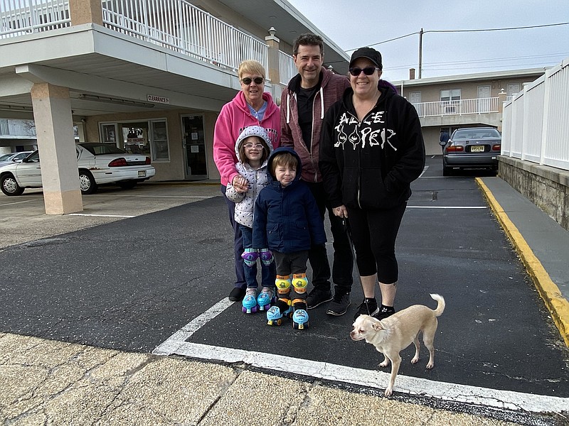 Joan McCrane, top left, with Pete and Kelly Hancock, kids Summer and Nathan, and their dog Chase.