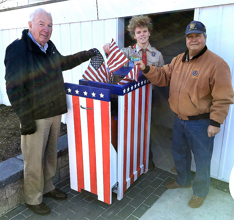 New Eagle Scout Caleb Schumacher is joined at his flag depository box by American Legion Post 524 Scouting Chairman Fred Distel, left, and Post Commander Bob Marzulli. (Photo courtesy Doug Otto) 