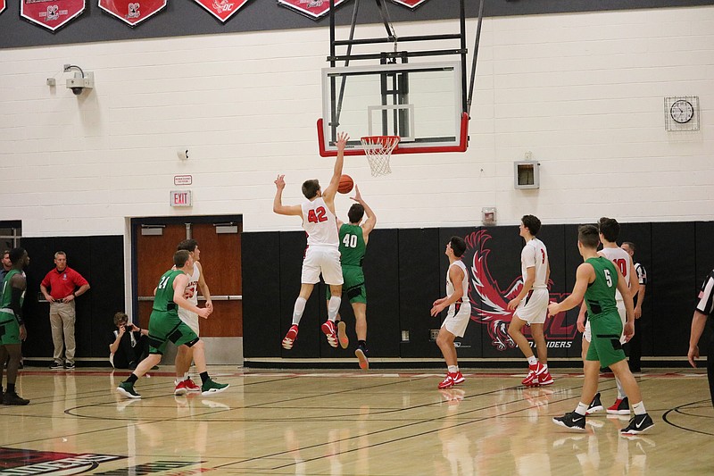 Mike Rhodes with the block on Mainland. 