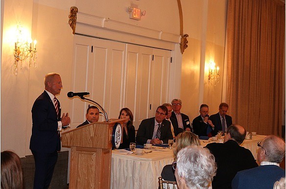 Congressman Jeff Van Drew gives remarks as dignitaries look on.