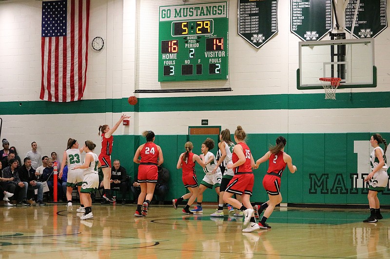 Ocean City's Lauren Mirsky puts up a three-pointer.