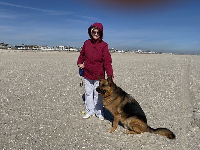 Lois Werner takes Maverick for a romp at the newly-widened 51st Street beach.