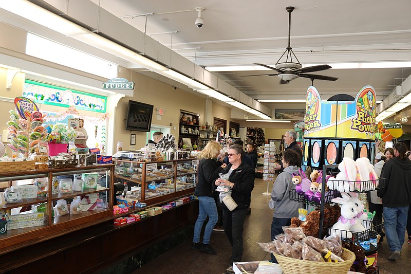 Shriver's Saltwater Taffy is one of the busy merchants along the Boardwalk Sunday.