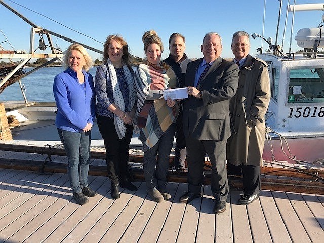 From right to left, Sturdy Savings Bank Business Development Officer Michael Lloyd and Director of Retail Banking David Repici present the sponsorship check to Bayshore Museum Curator Rachel Dolhanczyk, Executive Director Brian Keenan, Chief Financial Officer Candi Faunce, and Communication and Donor Relations Manager Lorraine Shourds. (Courtesy Sturdy Savings Bank)