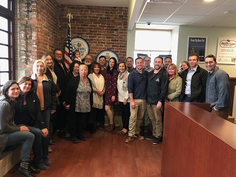 In a show of support, City Council candidate Gabe Staino is joined by friends and family members at City Hall.