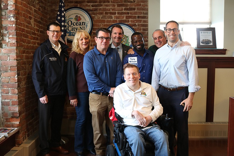 Councilman Tony Wilson, standing at center, is joined by, from left, Councilman Michael DeVlieger, Councilwoman Karen Bergman, Mayor Jay Gillian, Assemblyman Antwan McClellan, Councilman Keith Hartzell, Council President Peter Madden and Councilman Bob Barr on March 11 when he turned in his petitions. 