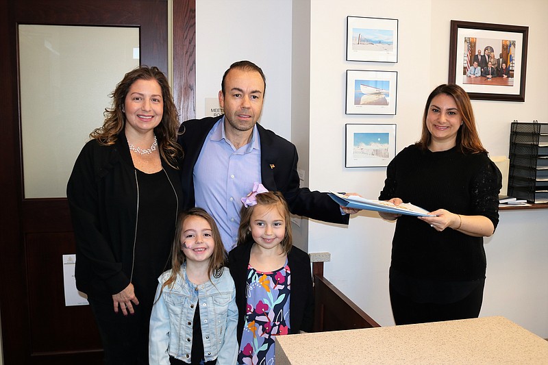 Jody Levchuk is accompanied by his wife, Jill, and daughters, Jordyn, 5, and Leni, 7, while handing in his nominating petitions to City Clerk Melissa Rasner in early March before the pandemic restrictions.