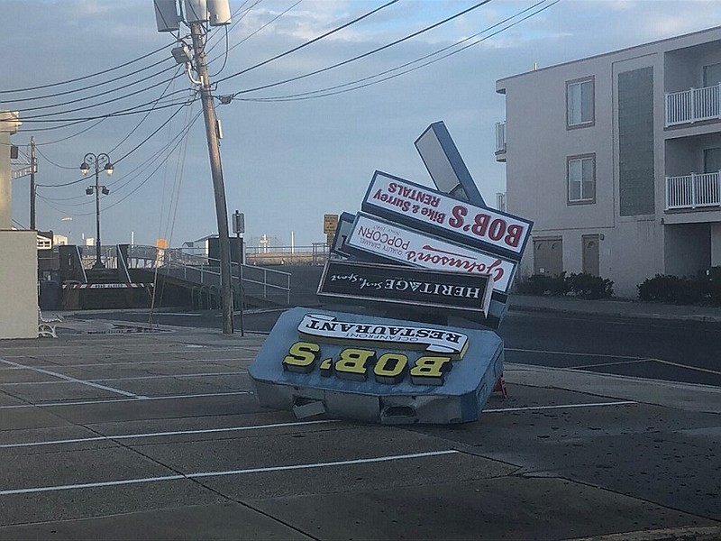 High winds topple the Bob's Grill sign at 13th Street and the Boardwalk.