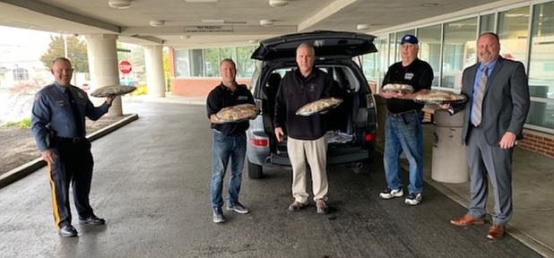 Making a food delivery to Cape Regional Medical Center are, from left, Middle Township Police Chief Christopher Leusner, Claudio Pawlus from Claudio’s Pizza Kitchen in Cape May Court House, Cape May County Police Academy Director Thomas DePaul, Bob Williams from Hugit’s Steaks and Things in Cape May Court House and Cape May County Prosecutor’s Office Chief of County Detectives Paul Skill. (Photo provided by Cape May County Chiefs of Police Association)