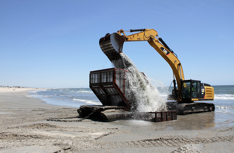 Excavators and other heavy construction machinery are used in beach replenishment projects. (Photo courtesy of U.S. Army Corps of Engineers)