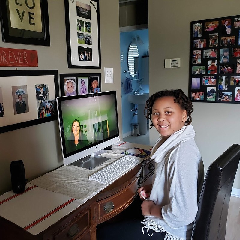 MariJoy Dempsey, of Egg Harbor Township, listens to Allyson Pace sing for her during an Ocean City Theatre Company virtual performance. (Photo courtesy the Dempsey family)